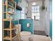 Well-appointed bathroom featuring a glass-enclosed shower, tile floors, and wooden shelves for storage at 824 Greenwood Ne Ave # 8, Atlanta, GA 30306