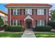 Charming brick home featuring a red tile roof, black shutters and mature landscaping at 824 Greenwood Ne Ave # 8, Atlanta, GA 30306