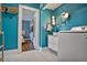 Stylish laundry room featuring tiled floors, built-in shelving, and washer hookups at 824 Greenwood Ne Ave # 8, Atlanta, GA 30306