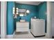 Well-lit laundry room with bright blue walls, modern vanity, and a new washer at 824 Greenwood Ne Ave # 8, Atlanta, GA 30306