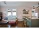Bright and airy living room featuring wood floors, a comfortable couch, and a view of the kitchen at 824 Greenwood Ne Ave # 8, Atlanta, GA 30306