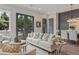 Open-concept living room with large windows, french doors, and a view into dining area at 931 Willingham Dr # 10, Hapeville, GA 30354