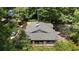 An aerial view of the home showcasing the roof, surrounded by lush green trees and well-maintained landscaping at 19 Wyman Se St, Atlanta, GA 30317