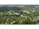 An aerial view of a neighborhood filled with mature trees, a school, and green spaces in a quiet residential area at 19 Wyman Se St, Atlanta, GA 30317