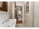 Bathroom with a pedestal sink, built-in cabinet and neutral finishes at 19 Wyman Se St, Atlanta, GA 30317