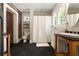 Bathroom features a modern sink, exposed brick, and black tile flooring at 19 Wyman Se St, Atlanta, GA 30317