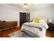 Bedroom with hardwood floors, neutral paint, large bed and decorative rug at 19 Wyman Se St, Atlanta, GA 30317