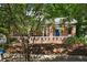 Charming brick home featuring a blue front door, landscaped yard, and inviting curb appeal at 19 Wyman Se St, Atlanta, GA 30317