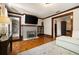 Cozy living room featuring hardwood floors, a decorative fireplace, and built-in shelving at 19 Wyman Se St, Atlanta, GA 30317