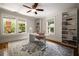 Office features built-in bookshelves, large windows and neutral walls at 19 Wyman Se St, Atlanta, GA 30317