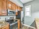 Modern kitchen features stainless steel appliances, hardwood floors, and granite countertops at 502 Pryor Sw St # 6, Atlanta, GA 30312