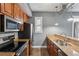 Well-lit kitchen features stainless steel appliances, hardwood floors, and granite countertops at 502 Pryor Sw St # 6, Atlanta, GA 30312