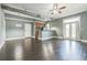 Open-concept living area features hardwood floors, a modern design, and a view of the kitchen at 502 Pryor Sw St # 6, Atlanta, GA 30312