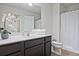 Modern bathroom featuring a vanity with a white countertop, mirror, and a shower with white curtain at 6345 Mountain Home Se Way, Mableton, GA 30126
