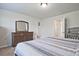 Bedroom with large bed, dresser, and access to bathroom and closet at 6345 Mountain Home Se Way, Mableton, GA 30126