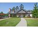 Exterior view of the community clubhouse with landscaped grounds and sidewalk at 6345 Mountain Home Se Way, Mableton, GA 30126
