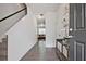 Inviting foyer with hardwood floors and a view into the living room at 6345 Mountain Home Se Way, Mableton, GA 30126