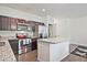 Modern kitchen with stainless steel appliances, granite countertops, and dark wood cabinetry at 6345 Mountain Home Se Way, Mableton, GA 30126