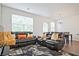 Cozy living room with large windows and comfortable seating at 6345 Mountain Home Se Way, Mableton, GA 30126