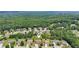 Beautiful aerial perspective of homes in a peaceful, tree-lined community at 852 Van Briggle Path, Sugar Hill, GA 30518
