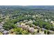 Sprawling neighborhood aerial, homes surrounded by vast, dense tree coverage at 852 Van Briggle Path, Sugar Hill, GA 30518