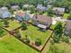 View of a home featuring a large fenced backyard with green lawns and mature trees at 852 Van Briggle Path, Sugar Hill, GA 30518