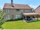 Spacious backyard with a covered patio, perfect for outdoor living and relaxation at 852 Van Briggle Path, Sugar Hill, GA 30518