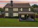 Backyard with spacious covered patio, manicured lawn and privacy fence at 852 Van Briggle Path, Sugar Hill, GA 30518