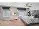 Serene bedroom features a tufted headboard and stylish window treatments at 852 Van Briggle Path, Sugar Hill, GA 30518