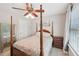 Bright bedroom featuring a four-poster bed, neutral walls and a ceiling fan at 852 Van Briggle Path, Sugar Hill, GA 30518