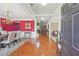 Elegant dining room featuring a striking red accent wall and a stylish chandelier at 852 Van Briggle Path, Sugar Hill, GA 30518