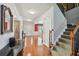 Inviting foyer with hardwood floors, staircase, and elegant decor setting a welcoming tone at 852 Van Briggle Path, Sugar Hill, GA 30518