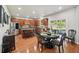 Open-concept kitchen with hardwood floors, island with seating, and sliding doors to the patio at 852 Van Briggle Path, Sugar Hill, GA 30518