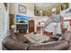 Expansive living room featuring a fireplace, beautiful staircase, and ample seating at 852 Van Briggle Path, Sugar Hill, GA 30518