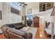 Inviting living room featuring high ceilings, a fireplace, and a view of the upper level at 852 Van Briggle Path, Sugar Hill, GA 30518