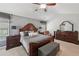 Spacious main bedroom with a decorative wall, sitting area and neutral decor at 852 Van Briggle Path, Sugar Hill, GA 30518