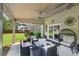 Cozy covered patio with outdoor seating and a ceiling fan, great for relaxation or entertaining at 852 Van Briggle Path, Sugar Hill, GA 30518