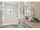 Beautiful bathroom featuring quartz counters, wood look floors, and walk-in shower with herringbone tile at 925 Willingham Dr # 13, Hapeville, GA 30354