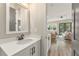 Well-lit bathroom features white cabinetry and modern fixtures at 925 Willingham Dr # 13, Hapeville, GA 30354