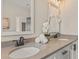 Bright bathroom featuring double sinks, quartz counters, neutral walls, and white cabinets at 925 Willingham Dr # 13, Hapeville, GA 30354
