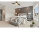 Cozy bedroom with accent wall, overhead fan, neutral colors, and carpet flooring at 925 Willingham Dr # 13, Hapeville, GA 30354