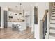 Modern white kitchen features an island with seating and stainless steel appliances at 925 Willingham Dr # 13, Hapeville, GA 30354