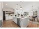 Open kitchen and dining area with island, stainless steel appliances, and modern finishes at 927 Willingham Dr # 12, Hapeville, GA 30354