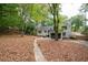 Backyard featuring patio, mature trees and a lush setting at 2377 Emory Ln, Marietta, GA 30068