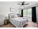 Cozy bedroom with a striped bedspread, throw blanket, and comfy pillows at 2377 Emory Ln, Marietta, GA 30068