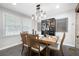 Charming dining room with a wooden table, seating for six, and modern lighting fixtures at 2377 Emory Ln, Marietta, GA 30068