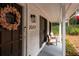 Inviting front porch featuring number 2377, a fall wreath, and classic wooden rocking chairs, great curb appeal at 2377 Emory Ln, Marietta, GA 30068