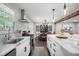 Well-lit kitchen with an island, stainless steel appliances, and an open view to the dining area at 2377 Emory Ln, Marietta, GA 30068