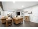 Comfortable living room featuring wood floors, a large television, exposed beam and natural light from the window at 2377 Emory Ln, Marietta, GA 30068