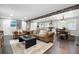Bright and spacious living room with exposed wooden beams, hardwood floors, and comfortable leather furnishings at 2377 Emory Ln, Marietta, GA 30068